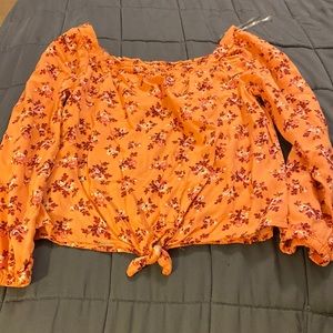 Pink shirt with maroon flowers